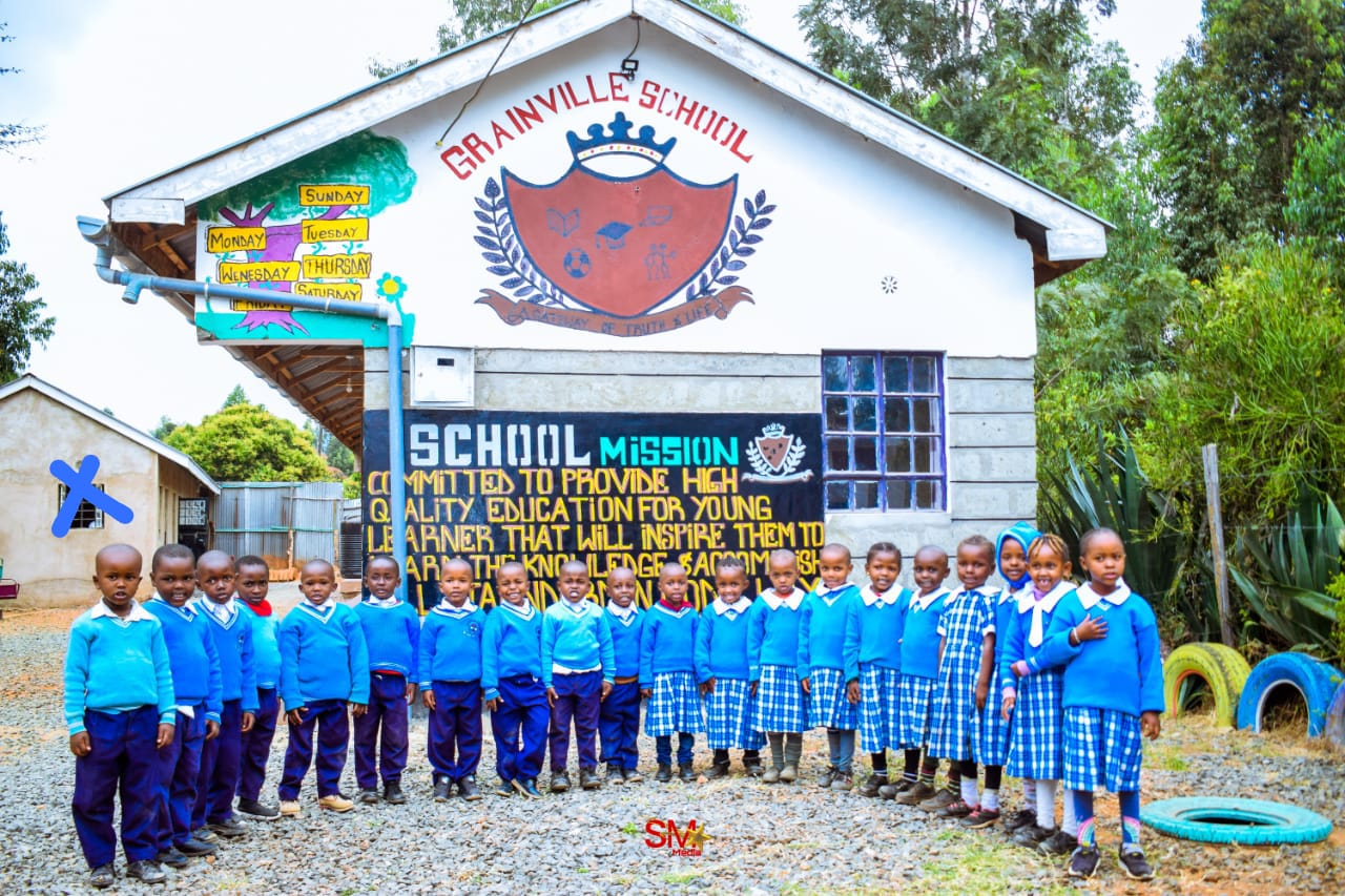 Students at the school mission wall