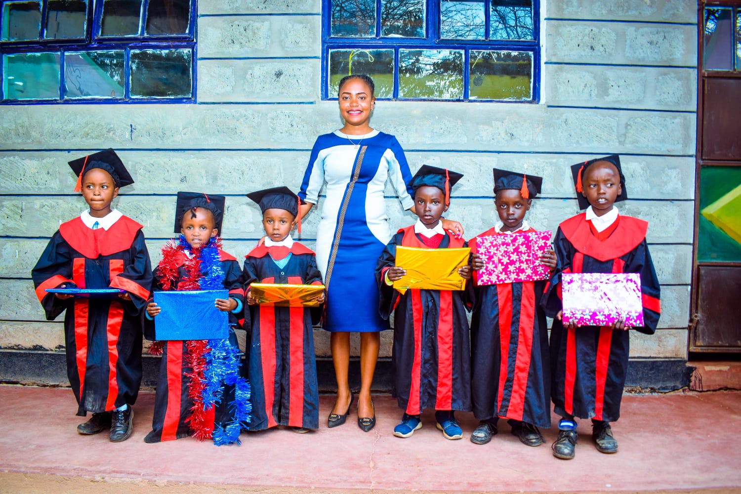 Teacher with graduating students